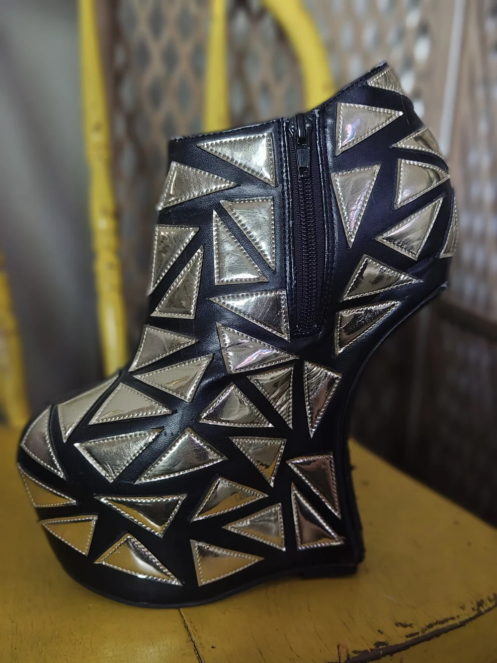 Prestiged Women's Black Ankle Wedge Booties with Gold Geometric Accents